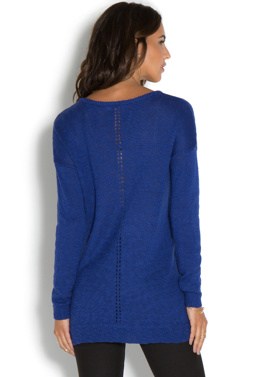V neck tunic sweater Slightly fitted through body. Tunic sweater hits at hip. Model is approximately 5'9